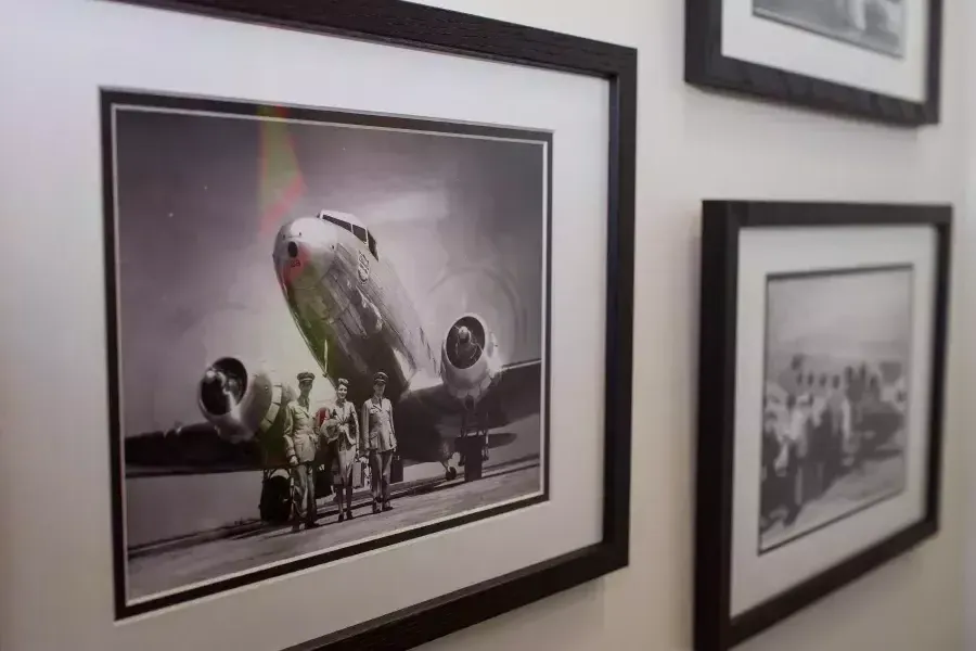 Old photographs of United planes on the wall.